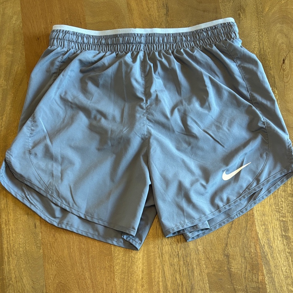 Nike Dri-Fit women’s lined running shorts with logo.